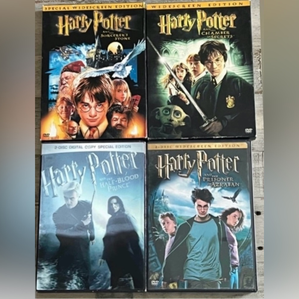 Four (4) Harry Potter wide screen movies - each contains two discs